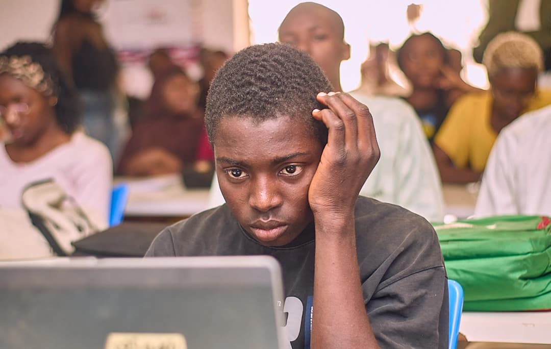 a male student staring at a laptop